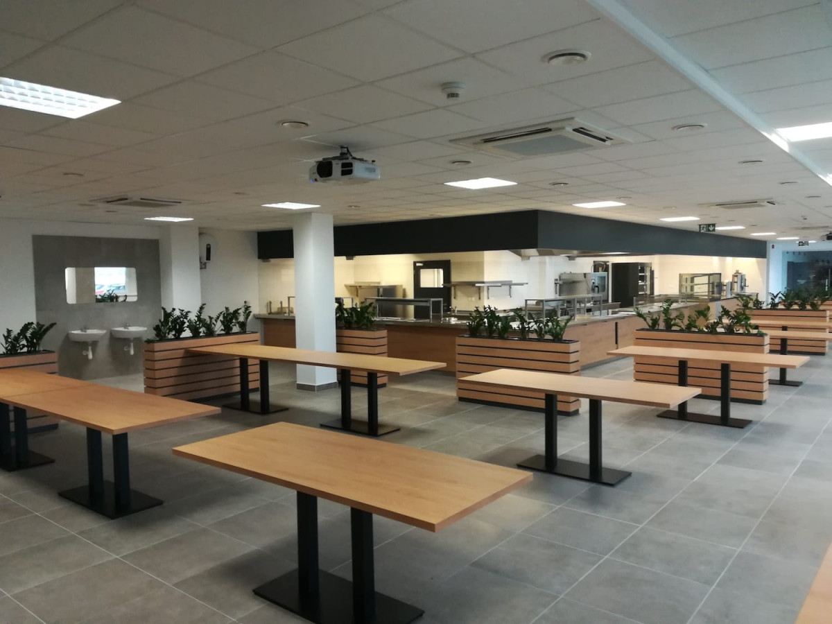 Reconstruction of a catering facility and roof cladding of a production hall